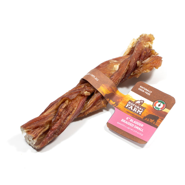 Natural Farm 15cm Braided Bladder Stick, 1 count. A gentle, all-natural premium soft dog chew on a white background, featuring official '.com.au' packaging that highlights it as a naturally odour-free treat perfectly sized for puppies and senior dogs in the Australian market.